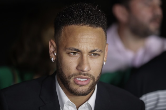 Brazil's soccer player Neymar speaks to the press as he leaves a police station where he answered questions about rape allegations against him in Sao Paulo, Brazil, Thursday, June 13, 2019. Neymar denies any wrongdoing. (AP Photo/Andre Penner)