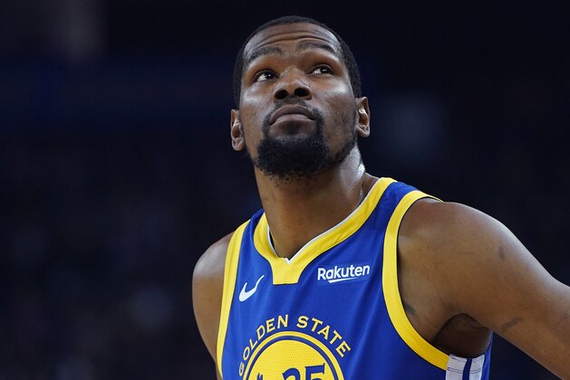 OAKLAND, CA - MARCH 31:  Kevin Durant #35 of the Golden State Warriors looks on against the Charlotte Hornets during the first half of an NBA Basketball game at ORACLE Arena on March 31, 2019 in Oakland, California. NOTE TO USER: User expressly acknowledges and agrees that, by downloading and or using this photograph, User is consenting to the terms and conditions of the Getty Images License Agreement.  (Photo by Thearon W. Henderson/Getty Images)