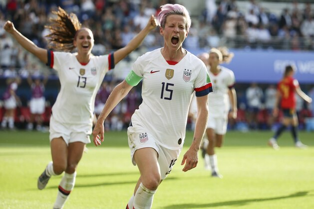 REIMS, FRANCE - JUNE 24: Megan Rapinoe of USA celebrates her winning goal on a penalty kick with Alex Morgan (#13) during the 2019 FIFA Women's World Cup France Round Of 16 match between Spain and USA at Stade Auguste Delaune on June 24, 2019 in Reims, France. (Photo by Jean Catuffe/Getty Images)