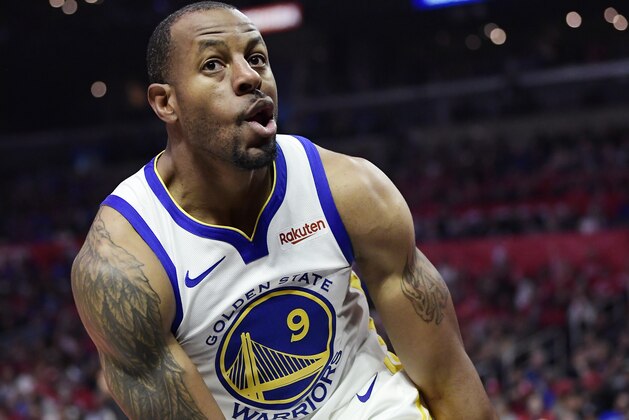Golden State Warriors guard Andre Iguodala, right, reacts after dunking during the second half in Game 4 of a first-round NBA basketball playoff series against the Los Angeles Clippers Sunday, April 21, 2019, in Los Angeles. The Warriors won 113-105. (AP Photo/Mark J. Terrill)