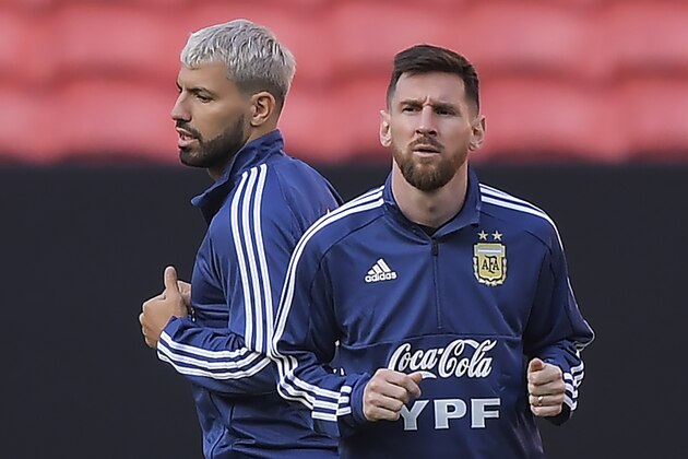 Argentina's Lionel Messi (R) and Sergio Aguero take part in a training session in Porto Alegre, Brazil, on June 21, 2019, ahead of a Copa America football match against Qatar on June 23. (Photo by Carl DE SOUZA / AFP)        (Photo credit should read CARL DE SOUZA/AFP/Getty Images)