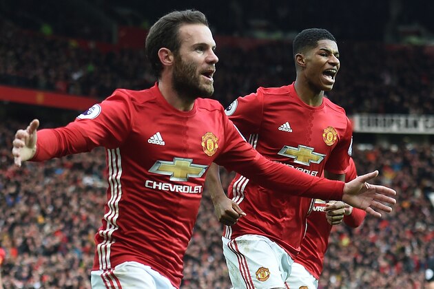 Manchester United's Spanish midfielder Juan Mata (L) celebrates scoring his team's first goal with Manchester United's English striker Marcus Rashford during the English Premier League football match between Manchester United and Arsenal at Old Trafford in Manchester, north west England, on November 19, 2016. / AFP / Paul ELLIS / RESTRICTED TO EDITORIAL USE. No use with unauthorized audio, video, data, fixture lists, club/league logos or 'live' services. Online in-match use limited to 75 images, no video emulation. No use in betting, games or single club/league/player publications.  /         (Photo credit should read PAUL ELLIS/AFP/Getty Images)