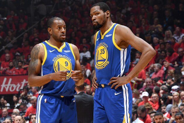 TORONTO, CANADA - JUNE 10: Andre Iguodala #9 and Kevin Durant #35 of the Golden State Warriors talk during Game Five of the NBA Finals against the Toronto Raptors on June 10, 2019 at Scotiabank Arena in Toronto, Ontario, Canada. NOTE TO USER: User expressly acknowledges and agrees that, by downloading and/or using this photograph, user is consenting to the terms and conditions of the Getty Images License Agreement. Mandatory Copyright Notice: Copyright 2019 NBAE (Photo by Andrew D. Bernstein/NBAE via Getty Images)