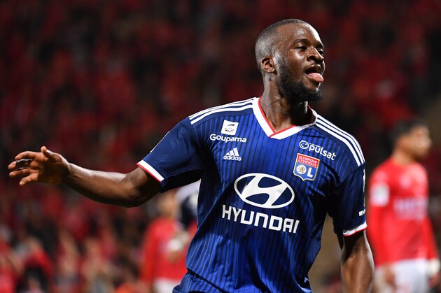 Lyon's French forward Tanguy NDombele Alvaro celebrates after scoring a goal during the French L1 football match between Nimes Olympique and Olympique Lyonnais (OL) at the Costieres stadium in Nimes, on May 24, 2019. (Photo by Pascal GUYOT / AFP)        (Photo credit should read PASCAL GUYOT/AFP/Getty Images)