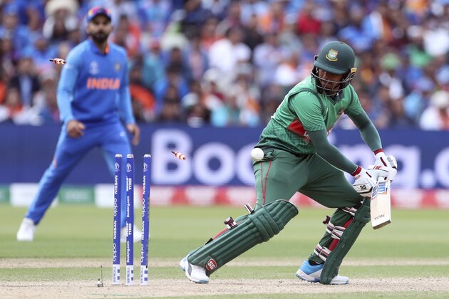 Bangladesh's Mosaddek Hossain is bowled out by India's Jasprit Bumrah during the Cricket World Cup match between Bangladesh and India at Edgbaston in Birmingham, England, Tuesday, July 2, 2019. (AP Photo/Aijaz Rahi)
