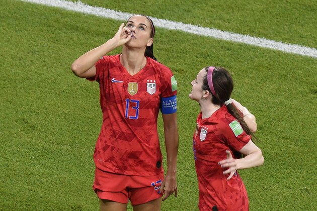 United States' forward Alex Morgan (L) is congratulated by teammates after scoring a goal during the France 2019 Women's World Cup semi-final football match between England and USA, on July 2, 2019, at the Lyon Satdium in Decines-Charpieu, central-eastern France. (Photo by Jean-Philippe KSIAZEK / AFP)        (Photo credit should read JEAN-PHILIPPE KSIAZEK/AFP/Getty Images)