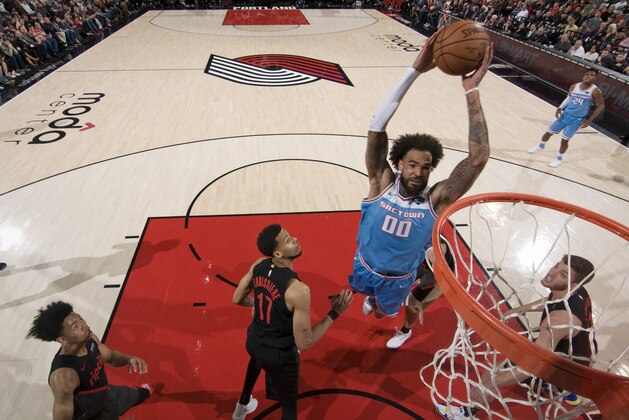 PORTLAND, OR - APRIL 10:  Willie Cauley-Stein #00 of the Sacramento Kings dunks the ball against the Portland Trail Blazers on April 10, 2019 at the Moda Center Arena in Portland, Oregon. NOTE TO USER: User expressly acknowledges and agrees that, by downloading and or using this photograph, user is consenting to the terms and conditions of the Getty Images License Agreement. Mandatory Copyright Notice: Copyright 2019 NBAE (Photo by Cameron Browne/NBAE via Getty Images)