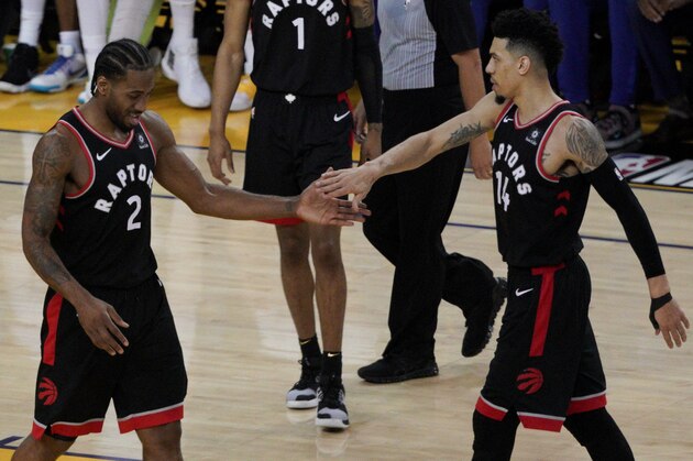 Toronto Raptors forward Kawhi Leonard (2) celebrates with Danny Green during the first half of Game 3 of basketball's NBA Finals against the Golden State Warriors in Oakland, Calif., Wednesday, June 5, 2019. (AP Photo/Tony Avelar)