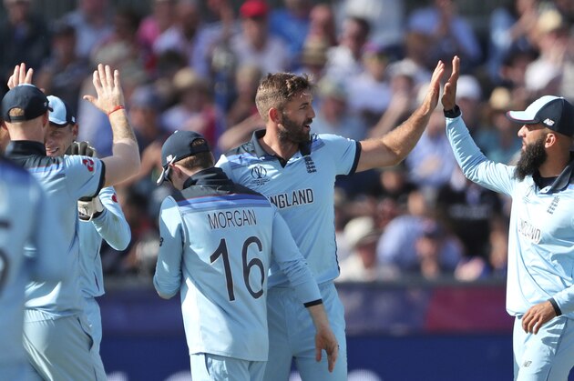 England's cricketers celebrate the dismissal of New Zealand's Tom Latham during the Cricket World Cup match between New Zealand and England in Chester-le-Street, England, Wednesday, July 3, 2019. (AP Photo/Scott Heppell)