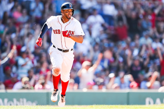 BOSTON, MA - JUNE 26: Xander Bogaerts #2 of the Boston Red Sox runs to first base after hitting a two-run RBI-single to take the lead in the eighth inning of a game against the Chicago White Sox at Fenway Park on June 26, 2019 in Boston, Massachusetts. (Photo by Adam Glanzman/Getty Images)