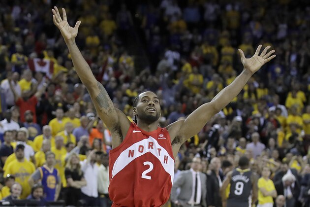 Toronto Raptors forward Kawhi Leonard celebrates after the Raptors defeated the Golden State Warriors in Game 6 of basketball's NBA Finals in Oakland, Calif., Thursday, June 13, 2019. (AP Photo/Ben Margot)