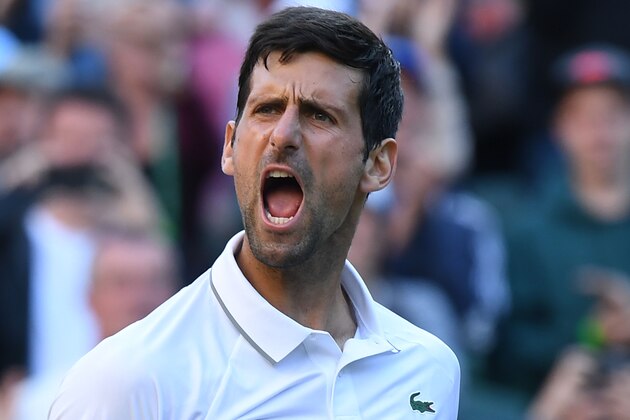Serbia's Novak Djokovic celebrates beating US player Denis Kudla during their men's singles second round match on the third day of the 2019 Wimbledon Championships at The All England Lawn Tennis Club in Wimbledon, southwest London, on July 3, 2019. (Photo by Ben STANSALL / AFP) / RESTRICTED TO EDITORIAL USE        (Photo credit should read BEN STANSALL/AFP/Getty Images)