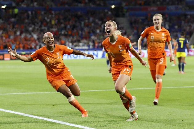 Netherlands' Jackie Groenen, center, celebrates after scoring during the Women's World Cup semifinal soccer match between the Netherlands and Sweden, at the Stade de Lyon outside Lyon, France, Wednesday, July 3, 2019. (AP Photo/Francisco Seco)
