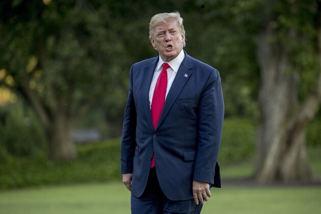 President Donald Trump walks across the South Lawn as he arrives at the White House, Sunday, June 30, 2019, in Washington. Trump returns from a visit with South Korean President Moon Jae-in and North Korean leader Kim Jong Un at the border village of Panmunjom in the Demilitarized Zone between North and South Korea as well as the G-20 summit in Osaka, Japan. (AP Photo/Andrew Harnik)