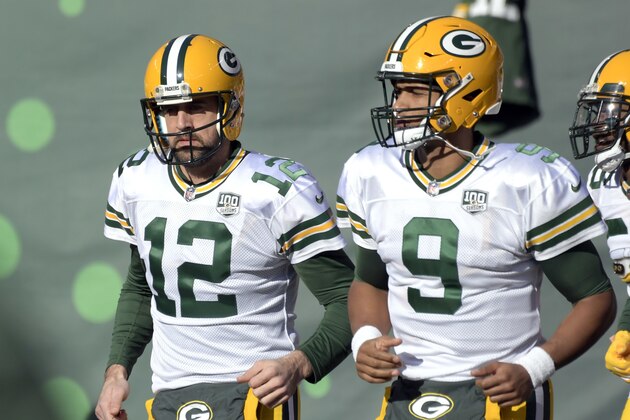 Green Bay Packers quarterbacks Aaron Rodgers (12) and DeShone Kizer (9) warm up prior to an NFL football game against the New York Jets, Sunday, Dec. 23, 2018, in East Rutherford, N.J. (AP Photo/Bill Kostroun)