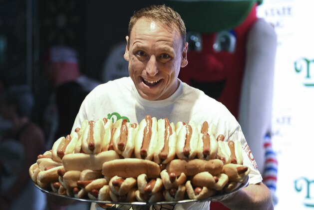 Eleven-time and defending men's champion Joey Chestnut participates in Nathan's Famous international Fourth of July hot dog eating contest weigh-in at the Empire State Building on Wednesday, July 3, 2019, in New York. (Photo by Evan Agostini/Invision/AP)