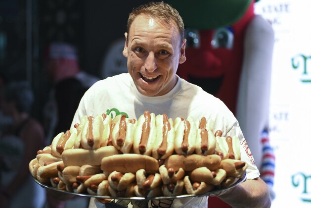 Eleven-time and defending men's champion Joey Chestnut participates in Nathan's Famous international Fourth of July hot dog eating contest weigh-in at the Empire State Building on Wednesday, July 3, 2019, in New York. (Photo by Evan Agostini/Invision/AP)