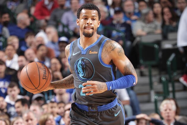 DALLAS, TX - APRIL 1:  Trey Burke #23 of the Dallas Mavericks brings the ball up the court against the Philadelphia 76ers on April 1, 2019 at the American Airlines Center in Dallas, Texas. NOTE TO USER: User expressly acknowledges and agrees that, by downloading and or using this photograph, User is consenting to the terms and conditions of the Getty Images License Agreement. Mandatory Copyright Notice: Copyright 2019 NBAE (Photo by Glenn James/NBAE via Getty Images)