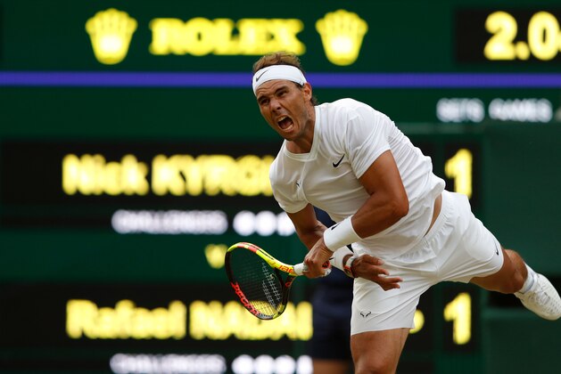 Spain's Rafael Nadal serves against Australia's Nick Kyrgios during their men's singles second round match on the fourth day of the 2019 Wimbledon Championships at The All England Lawn Tennis Club in Wimbledon, southwest London, on July 4, 2019. (Photo by Adrian DENNIS / AFP) / RESTRICTED TO EDITORIAL USE        (Photo credit should read ADRIAN DENNIS/AFP/Getty Images)