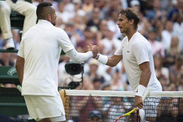 LONDON, ENGLAND - JULY 04: Rafael Nadal of Spain shakes hands with Nick Kyrgios of Australia during Day Four of The Championships - Wimbledon 2019 at All England Lawn Tennis and Croquet Club on July 4, 2019 in London, England. (Photo by Visionhaus/Getty Images)