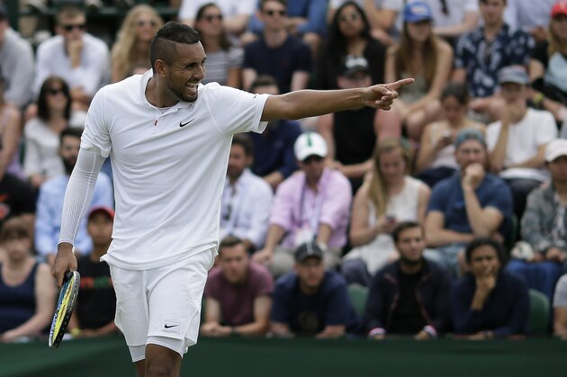 Australia's Nick Kyrgios gestures as he plays Australia's Jordan Thompson in a Men's singles match during day two of the Wimbledon Tennis Championships in London, Tuesday, July 2, 2019. (AP Photo/Tim Ireland)