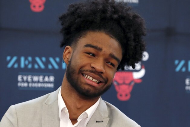 Chicago Bulls first-round draft pick North Carolina guard Coby White laughs during an NBA basketball news conference Monday, June 24, 2019, in Chicago. (AP Photo/Charles Rex Arbogast)