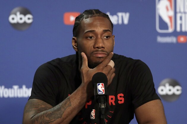 Toronto Raptors forward Kawhi Leonard speaks to reporters before a team practice in Oakland, Calif., Wednesday, June 12, 2019. The Raptors are scheduled to play the Golden State Warriors in Game 6 of basketball's NBA Finals on Thursday. (AP Photo/Jeff Chiu)