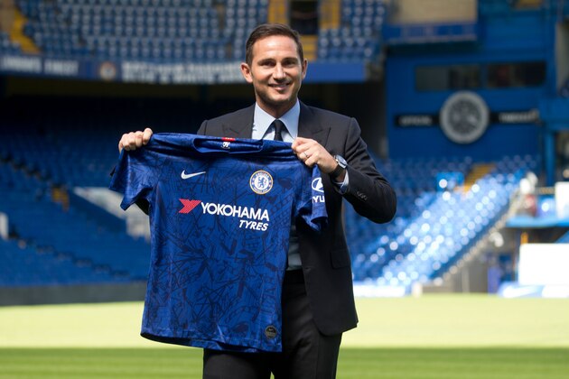 Chelsea's newly appointed English head coach Frank Lampard poses for the press at Stamford Bridge in London on July 4, 2019. - Frank Lampard was appointed Chelsea head coach today, confirming a dramatic return for one of the club's greatest ever players. Lampard has signed a three-year contract with the Premier League club, where he spent 13 years and became the team's all-time leading scorer with 211 goals. (Photo by Isabel Infantes / AFP)        (Photo credit should read ISABEL INFANTES/AFP/Getty Images)