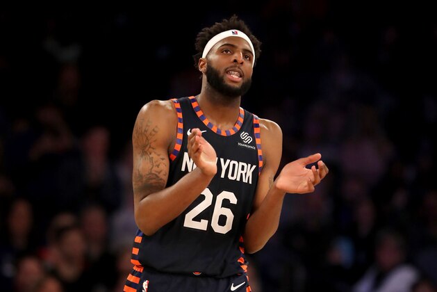 NEW YORK, NEW YORK - APRIL 07:   Mitchell Robinson #26 of the New York Knicks celebrates the win over the Washington Wizards at Madison Square Garden on April 07, 2019 in New York City. The New York Knicks defeated the Washington Wizards 113-110.NOTE TO USER: User expressly acknowledges and agrees that, by downloading and or using this photograph, User is consenting to the terms and conditions of the Getty Images License Agreement. (Photo by Elsa/Getty Images)