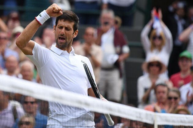Serbia's Novak Djokovic celebrates after beating Poland's Hubert Hurkacz during their men's singles third round match on the fifth day of the 2019 Wimbledon Championships at The All England Lawn Tennis Club in Wimbledon, southwest London, on July 5, 2019. (Photo by Ben STANSALL / AFP) / RESTRICTED TO EDITORIAL USE        (Photo credit should read BEN STANSALL/AFP/Getty Images)