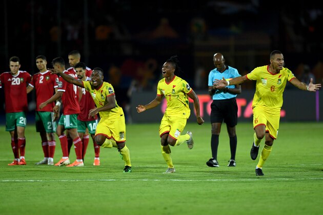 Benin players celebrate after winning the 2019 Africa Cup of Nations (CAN) Round of 16 football match between Morocco and Benin at the Al-Salam Stadium in the Egyptian capital Cairo on July 5, 2019. (Photo by OZAN KOSE / AFP)        (Photo credit should read OZAN KOSE/AFP/Getty Images)