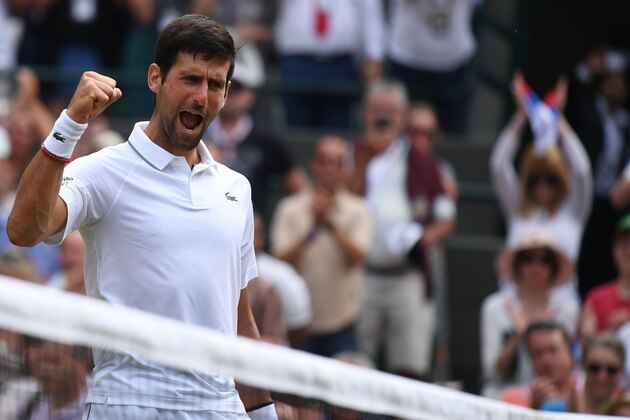 Serbia's Novak Djokovic celebrates after beating Poland's Hubert Hurkacz during their men's singles third round match on the fifth day of the 2019 Wimbledon Championships at The All England Lawn Tennis Club in Wimbledon, southwest London, on July 5, 2019. (Photo by Ben STANSALL / AFP) / RESTRICTED TO EDITORIAL USE        (Photo credit should read BEN STANSALL/AFP/Getty Images)