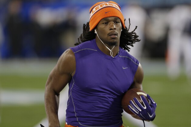FILE - In this Dec. 5, 2015, file photo, Clemson's Tyshon Dye warms up prior to the Atlantic Coast Conference championship NCAA college football game against North Carolina in Charlotte, N.C. Former Clemson and East Carolina running back Tyshon Dye drowned Friday, July 5, 2019 after swimming in a lake during a family outing. (AP Photo/Bob Leverone, File)
