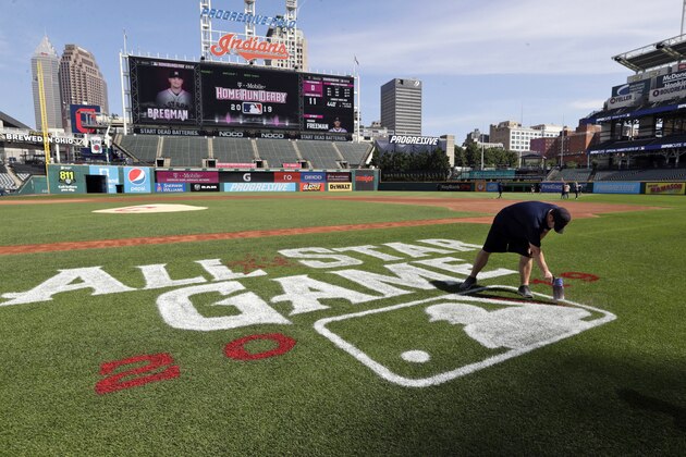 A member of the grounds crew paints All-Star Game 2019 at Progressive Field, Wednesday, July 3, 2019, in Cleveland. The 90th baseball All-Star Game will be played on Tuesday, July 9 in Cleveland. (AP Photo/Tony Dejak)