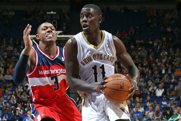 LEXINGTON, KY - OCTOBER 19: Jrue Holiday #11 of the New Orleans Pelicans drives past Bradley Beal #3 of the Washington Wizards during an NBA game on October 19, 2013 at Rupp Arena in Lexington, Kentucky. NOTE TO USER: User expressly acknowledges and agrees that, by downloading and or using this Photograph, user is consenting to the terms and conditions of the Getty Images License Agreement. Mandatory Copyright Notice: Copyright 2013 NBAE (Photo by Layne Murdoch/NBAE via Getty Images)