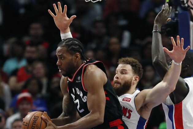Toronto Raptors forward Kawhi Leonard (2) looks to pass as Detroit Pistons forward Blake Griffin defends during the second half of an NBA basketball game, Sunday, March 17, 2019, in Detroit. (AP Photo/Carlos Osorio)