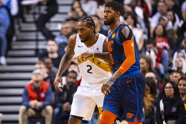 TORONTO, CANADA - MARCH 22:  Kawhi Leonard #2 of the Toronto Raptors and Paul George #13 of the Oklahoma City Thunder defend their positions during the game on March 22, 2019 at Scotiabank Arena in Toronto, Ontario, Canada. NOTE TO USER: User expressly acknowledges and agrees that, by downloading and/or using this photograph, user is consenting to the terms and conditions of the Getty Images License Agreement. Mandatory Copyright Notice: Copyright 2019 NBAE (Photo by Zach Beeker/NBAE via Getty Images)