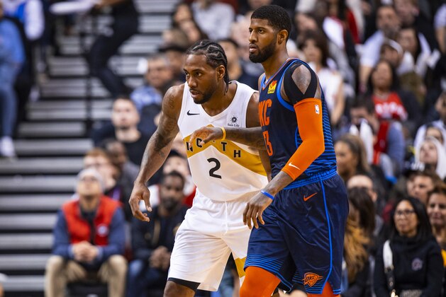 TORONTO, CANADA - MARCH 22:  Kawhi Leonard #2 of the Toronto Raptors and Paul George #13 of the Oklahoma City Thunder defend their positions during the game on March 22, 2019 at Scotiabank Arena in Toronto, Ontario, Canada. NOTE TO USER: User expressly acknowledges and agrees that, by downloading and/or using this photograph, user is consenting to the terms and conditions of the Getty Images License Agreement. Mandatory Copyright Notice: Copyright 2019 NBAE (Photo by Zach Beeker/NBAE via Getty Images)
