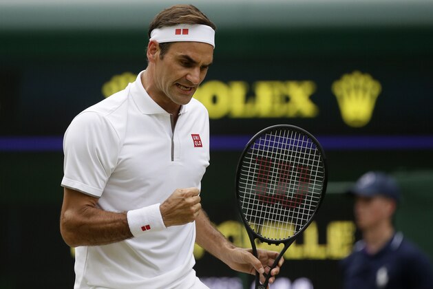 Switzerland's Roger Federer celebrates after winning a point against Lucas Pouile of France in a Men's singles match during day six of the Wimbledon Tennis Championships in London, Saturday, July 6, 2019. (AP Photo/Tim Ireland)