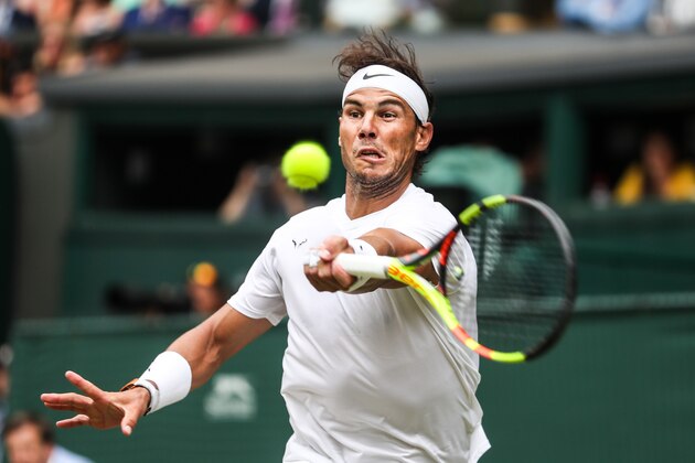 LONDON, ENGLAND - JULY 06: Rafael Nadal of Spain plays a forehand in his Men's Singles third round match against Jo-Wilfred Tsonga of France during Day six of The Championships - Wimbledon 2019 at All England Lawn Tennis and Croquet Club on July 06, 2019 in London, England. (Photo by Shi Tang/Getty Images)