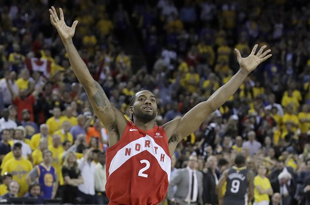 Toronto Raptors forward Kawhi Leonard celebrates after the Raptors defeated the Golden State Warriors in Game 6 of basketball's NBA Finals in Oakland, Calif., Thursday, June 13, 2019. (AP Photo/Ben Margot)