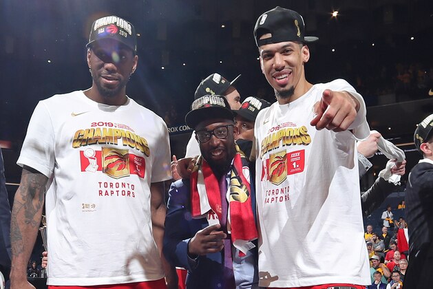 OAKLAND, CA - JUNE 13: Kawhi Leonard #2 and Danny Green #14 of the Toronto Raptors react onstage after defeating the Golden State Warriors in Game Six of the 2019 NBA Finals on June 13, 2019 at ORACLE Arena in Oakland, California. NOTE TO USER: User expressly acknowledges and agrees that, by downloading and/or using this photograph, user is consenting to the terms and conditions of Getty Images License Agreement. Mandatory Copyright Notice: Copyright 2019 NBAE (Photo by Nathaniel S. Butler/NBAE via Getty Images)