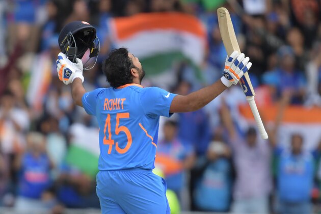 TOPSHOT - India's Rohit Sharma celebrates after reaching his century during the 2019 Cricket World Cup group stage match between Sri Lanka and India at Headingley in Leeds, northern England, on July 6, 2019. (Photo by Dibyangshu Sarkar / AFP) / RESTRICTED TO EDITORIAL USE        (Photo credit should read DIBYANGSHU SARKAR/AFP/Getty Images)