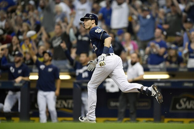 MILWAUKEE, WISCONSIN - JUNE 30: Christian Yelich #22 of the Milwaukee Brewers hits a double in the third inning against the Pittsburgh Pirates for his 1,000th career hit at Miller Park on June 30, 2019 in Milwaukee, Wisconsin. (Photo by Quinn Harris/Getty Images)