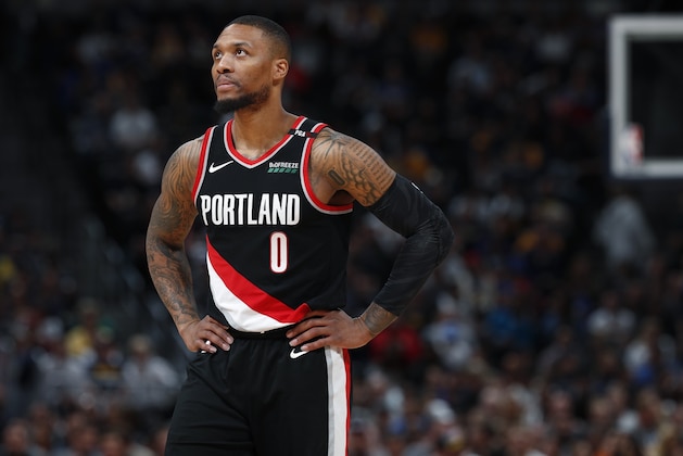 Portland Trail Blazers guard Damian Lillard looks on during a timeout against the Denver Nuggets in the first half of Game 5 of an NBA basketball second-round playoff series, Tuesday, May 7, 2019, in Denver. (AP Photo/David Zalubowski)