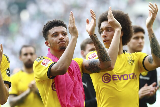 MOENCHENGLADBACH, GERMANY - MAY 18: Jadon Malik Sancho of Borussia Dortmund and Axel Witsel of Borussia Dortmund gesture after the Bundesliga match between Borussia Moenchengladbach and Borussia Dortmund at Borussia-Park on May 18, 2019 in Moenchengladbach, Germany. (Photo by TF-Images/Getty Images)