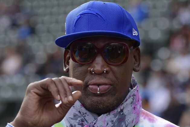 FILE - In this Dec. 9, 2018, file photo, former NBA basketball player Dennis Rodman attends an NFL football game between the Los Angeles Chargers and the Cincinnati Bengals in Carson, Calif. The owner of a Southern California yoga studio is accusing Dennis Rodman of helping three people steal more than $3,500 in merchandise from his business. Ali Shah says security cameras captured the former NBA star walking into Vibes Hot Yoga in Newport Beach on Tuesday, May 7, 2019, with his alleged accomplices. (AP Photo/Mark J. Terrill, File)