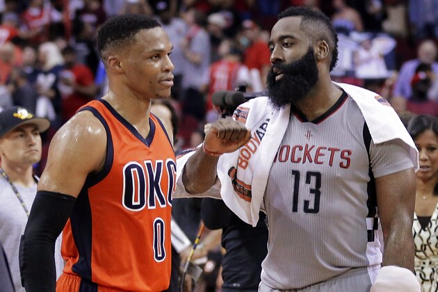 Oklahoma City Thunder's Russell Westbrook (0) and Houston Rockets' James Harden (13) talk on the court after an NBA basketball game in Houston, Sunday, March 26, 2017. (AP Photo/Michael Wyke)