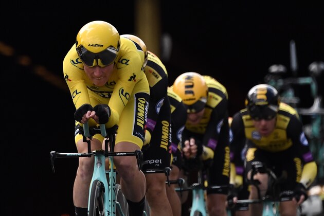 Dutch rider Mike Teunissen (L) wearing the overall leader's yellow jersey and teammates of Netherlands' Jumbo-Visma cycling team compete in the second stage of the 106th edition of the Tour de France cycling race, a 27.6km team time-trial in Brussels, Belgium, on July 7, 2019. - Today's stage is a technically tricky team time trial with a 27.6km Brussels city-centre route, with Deceuninck and Ineos the favourites. (Photo by Marco Bertorello / AFP)        (Photo credit should read MARCO BERTORELLO/AFP/Getty Images)