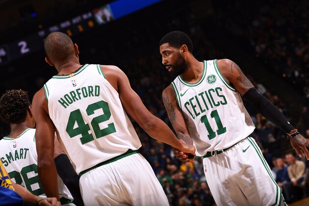 OAKLAND, CA - MARCH 5: Al Horford #42 shakes hands with Kyrie Irving #11 of the Boston Celtics on March 5, 2019 at ORACLE Arena in Oakland, California. NOTE TO USER: User expressly acknowledges and agrees that, by downloading and or using this photograph, user is consenting to the terms and conditions of Getty Images License Agreement. Mandatory Copyright Notice: Copyright 2019 NBAE (Photo by Noah Graham/NBAE via Getty Images)